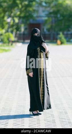Muslim woman in full growth, urban lifestyle. Stock Photo