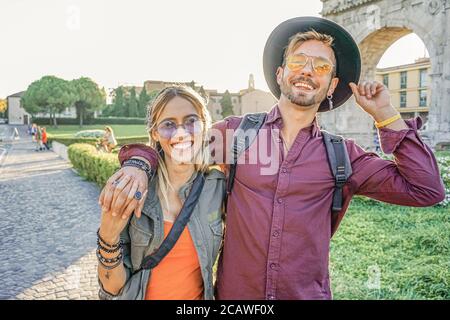Happy tourist couple in vacation - Tourists enjoying the sun - Lifestyle of couple travelling around world - Journey in Italy Stock Photo