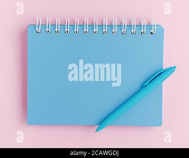 Closed blue notebook and pen on pink background. Top view, mockup. Stock Photo