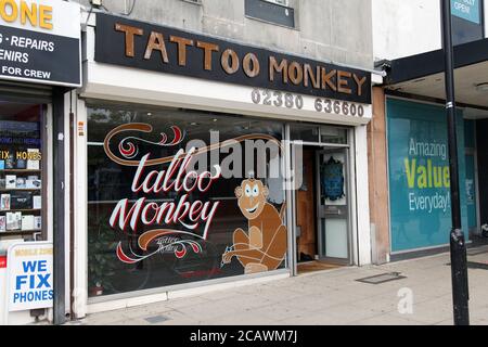 Tattoo tagged with: calf, black, animal, red, blue, yellow, monkey,  cartoon, pink, primate, tatuaje, tatuajes, medium size, pengi, green, brown  | inked-app.com