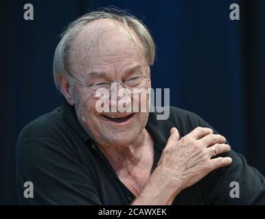 Neuhardenberg, Germany. 07th Aug, 2020. Klaus Maria Brandauer, Austrian actor and director, takes photographs during a reading rehearsal before his performance on the stage of the Stiftung Schloss Neuhardenberg. Credit: Patrick Pleul/dpa-Zentralbild/ZB/dpa/Alamy Live News Stock Photo