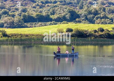 Ballingeary, Cork, Ireland. 09th August, 2020. On a hot summers day three men fish  for pike on Lough Aulla near Ballingeary, Co. Cork, Ireland. - Credit; David Creedon / Alamy Live News Stock Photo