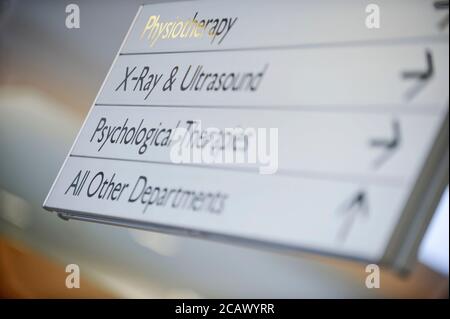 A signpost to hospital departments. Stock Photo