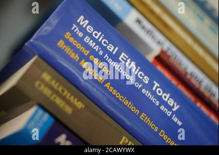 Medical Ethics Today handbook on a book shelf in a library. Stock Photo