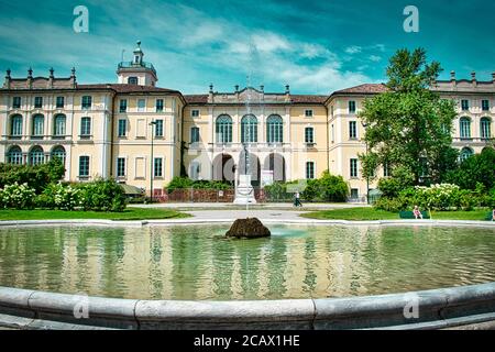 Milan, Italy 08.08.2020: Fountain in front of Palazzo Dugnani, Dugnani Palace. Grand 17th-century palace with baroque frescoes & public garden, now an Stock Photo