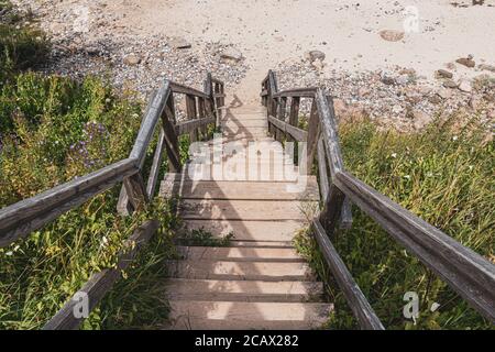 Picturesque wooden stairs leading downwards to a Beach at the Baltic Sea in Germany. Royalty free stock photo. Stock Photo
