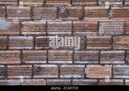 red aged grunge retro old vintage curved pattern brick wall, rich colors and shadows suitable for website background marketing backgrounds backdrops Stock Photo