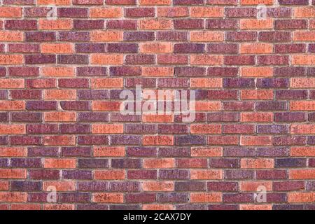 red brown colored textured lined aligned pattern brick wall, rich colors and shadows suitable for website background marketing backgrounds backdrops Stock Photo