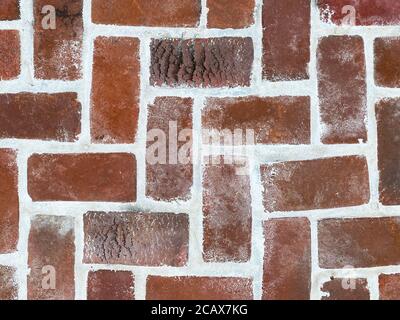 vintage close-up view clean textured red pave pattern brick, new grout looking down suitable for website background marketing backgrounds backdrops Stock Photo