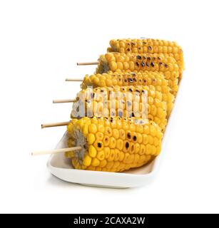 Grilled  sweet corn on the cob isolated on white Stock Photo