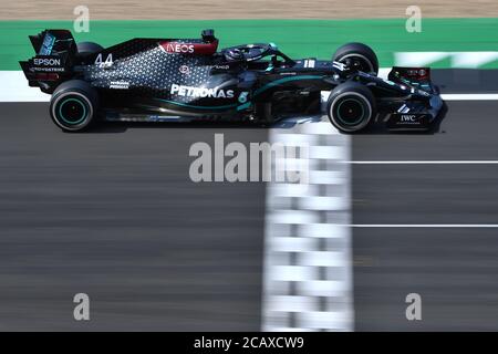 Mercedes' British driver Lewis Hamilton drives during the 70th Anniversary Formula One Grand Prix at Silverstone Race circuit, Northampton. Stock Photo