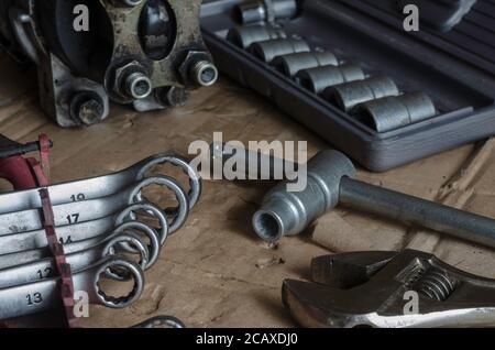 Different wrenches close-up. Set of ring spanners and adjustable spanner. Industrial theme, hand tool background. Selective focus. Stock Photo