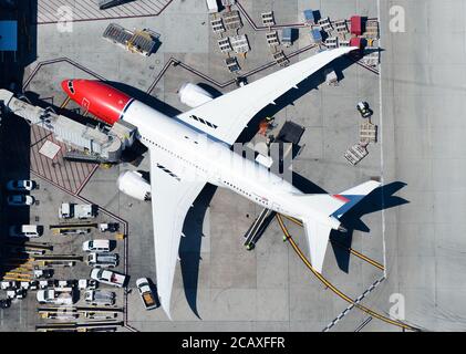 Norwegian Air Boeing 787 at LAX Airport docked to a jet bridge. Norwegian Air Shuttle Dreamliner aircraft registered as LN-LNC. Stock Photo