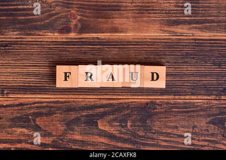 Fraud word concept on cubes. Concept of business, technology, Internet and network Stock Photo