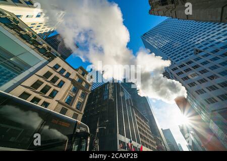 The steam rises and drifts Among the Midtown Manhattan 5th Avenue Stock Photo