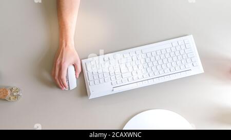 the developer works at the computer, uses the mouse Stock Photo