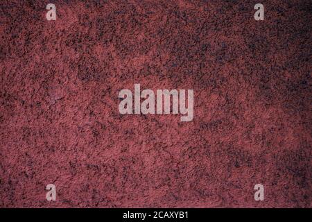 Empty dusty burgundy red textured surface. Stock Photo