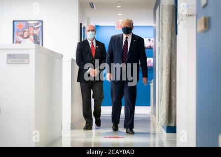 U.S. President Donald Trump, right, and Chris Hrouda, president of the American Red Cross Blood Services, tours the donation center prior to a roundtable on donating plasma at the American Red Cross National Headquarters July 30, 2020 in Washington, DC. Stock Photo