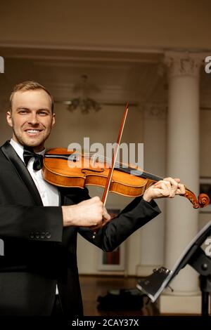 awesome musician with violin, classical music performer professionally play violin. music, instruments concept Stock Photo