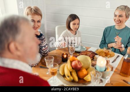 Smiling friendly people sitting at dining table. close up shot. happiness, friendship, holiday Stock Photo