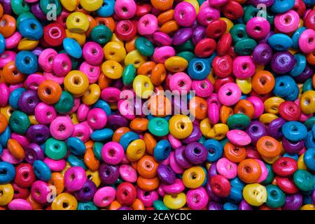 Various sewing Colorful wooden beads as background Stock Photo
