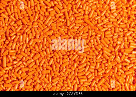 Orange sprinkles background, halloween theme, textured close-up image Stock Photo