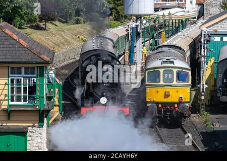 The steam locomotive late 1920s-built Southern Railway U class No. 31806 leaving Swanage Railway station, England Stock Photo