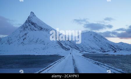 Snow capped mountains after sunset near Fredvang on the Lofoten Islands of Norway. Stock Photo