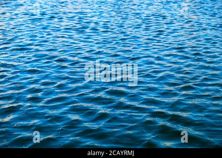 Empty water surface with blue ripples. Stock Photo