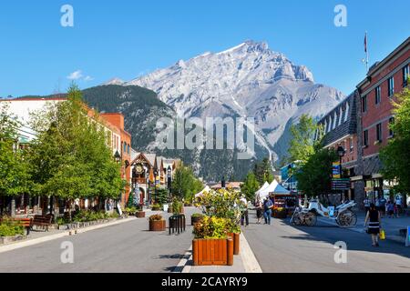 BANFF CANADA JULY 29 2020 Tourists walk along Banff Avenue in