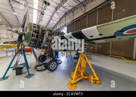 Grumman F4F Wildcat under maintenance in a hangar at Imperial War Museum, Duxford, Cambridgeshire, UK Stock Photo