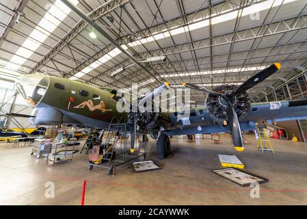 Sally B, Boeing B-17 Flying Fortress, undergoing maintenance in hangar at Imperial War Museum, Duxford, Cambridgeshire, UK. COVID-19 grounding Stock Photo