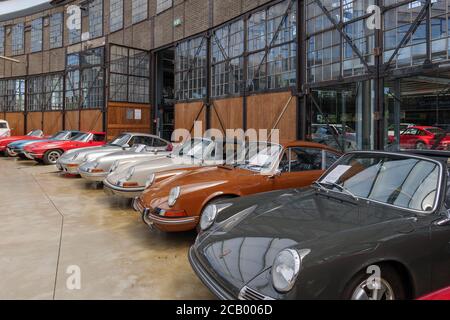 Old Antique classic unique and vintage Porsche cars Collections exhibit inside Classic Remise, historical building. Stock Photo