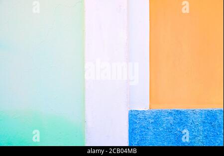 Pale color bands: blue, green white and orange, painted surface, hard light. Stock Photo