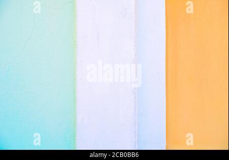 Pale color bands: green white and orange, painted surface, hard light. Stock Photo
