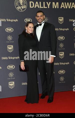 Greg Inglis of the Rabbitohs and pregnant wife Sally Robinson arrive on the red carpet for the 2016 Dally M. Stock Photo