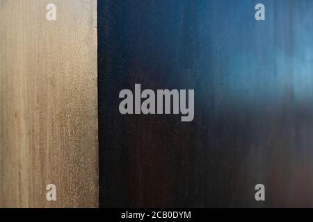Aged and varnished steel plate, selective focus with offset light and dark sections, abstract graphic element. Stock Photo