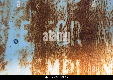 Metal texture rust, white background and typography abstract lettering on signage. Stock Photo