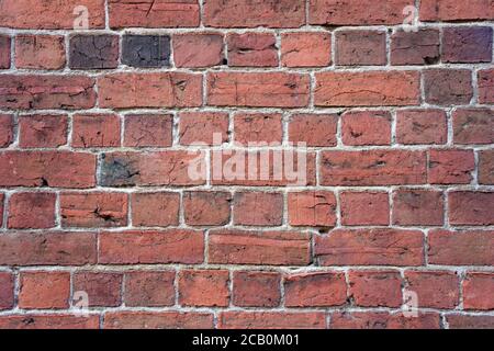 Old brick wall background with vintage brick shapes, mortar and abstract line patterns. Stock Photo