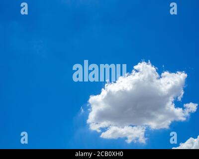 One white cloud in blue sky with copy space. Stock Photo