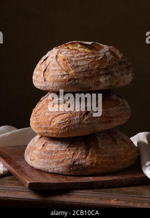 Freshly baked sourdough bread with floral decoration on it Stock Photo