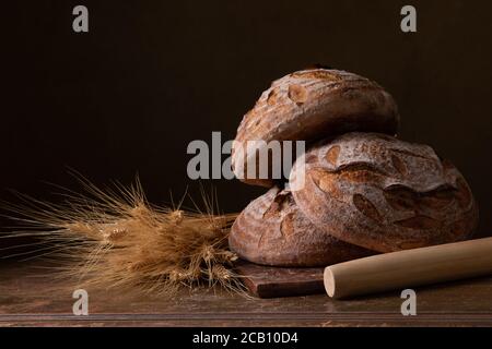 Freshly baked sourdough bread with floral decoration on it