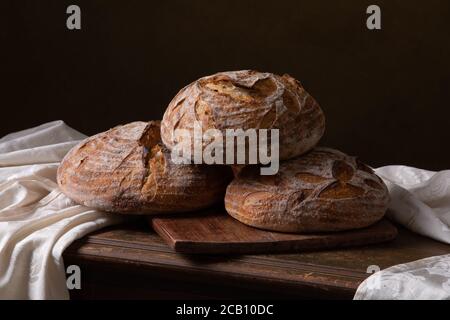 Freshly baked sourdough bread with floral decoration on it Stock Photo