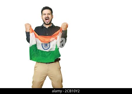 Cheerful young man holding indian flag screams with excitement, celebrating republic day or independence day, isolated on white background copy space Stock Photo