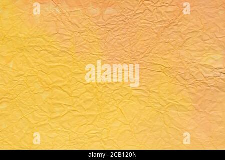 creased painted orange color paper background texture Stock Photo