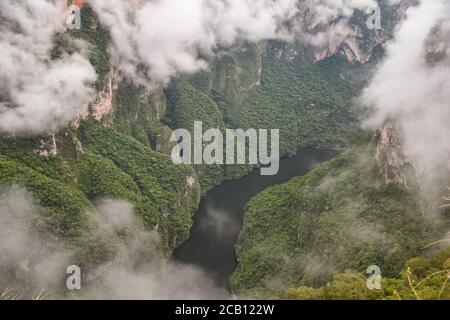 Dramatic scenic aerial view of Sumidero Canyon National Park deep natural canyon between clouds, Chiapas, Mexico Stock Photo