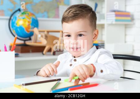 Back to school and happy kids time. School concept. Child reading for education. Stock Photo