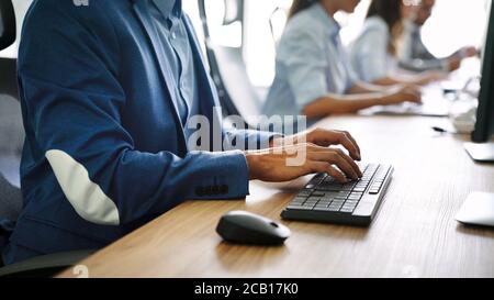Close up of hands contemporary website developer man typing and writing code for program Stock Photo