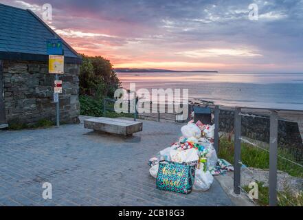 Myrtleville, Cork, Ireland. 10th August, 2020.  Overflowing bins with bags of rubbish left behind following on from the glorious weather over the weekend which saw people flock to the beach at picturesque Myrtleville, Co. Cork, Ireland. - Credit; David Creedon / Alamy Live News Stock Photo