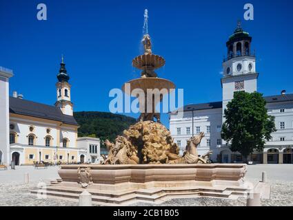 Residenzplatz, Residence Fountain with St. Michael's Church and carillon, Salzburg, Austria Stock Photo